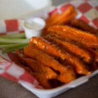 Buffalo Chicken Fingers · Golden and fried chicken served with buffalo sauce.
