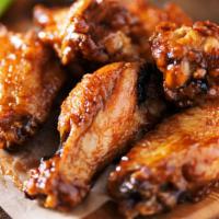 Bbq Wings · Deliciously crispy party wings with savory BBQ Sauce. Comes with celery and bleu cheese.