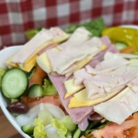Chef Salad · Sliced turkey breast, ham, provolone & American cheeses on top of crisp lettuce, sliced red ...