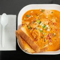 Shrimp & Grits · Creamy grits topped w/ sautéed shrimp, tomatoes, bacon & cheddar cheese. Served w/ toast.
