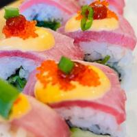 Red Tokyo Roll (Inside Out) · Spicy Tuna, avocado, seaweed, cucumber, topped with torched Tuna, orange tobiko, scallions, ...