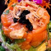 Tuna And Salmon Tartare · Diced fresh Tuna and Salmon in ginger soy lemon dressing, avocado, scallions, served with se...