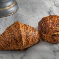 Pain Au Chocolat · Traditional buttery recipe with batons. Two to a bag.