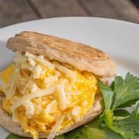 Messy Egg And Cheese Sandwich · English muffin with eggs and shredded cheddar.