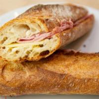 Ham & Cheese Baguette · Heritage ham, Gruyere cheese, a touch of Dijon on our buttered baguette.