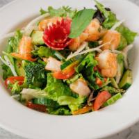 Vietnamese Shrimp Salad · sauté shrimp and onions in vinaigrette dressing on a bed of green salad, carrot, chopped pea...