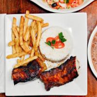 Grilled Pork Loin · Served with rice, beans, salad, and french fries.