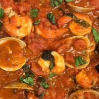 Trio Seafood Combination · over spaghetti, marinara sauce, fresh basil, shrimp, clam, mussels served with garlic bread ...