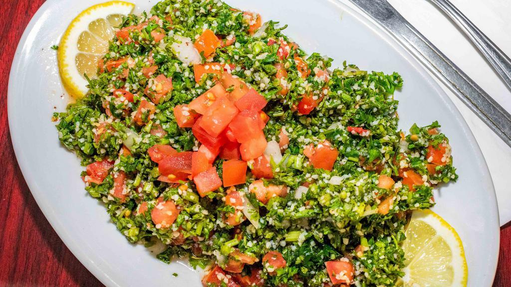 Tabbouleh (Small) · Fresh minced parsley, diced tomatoes, cracked wheat, onions, lemon juice, and olive oil.