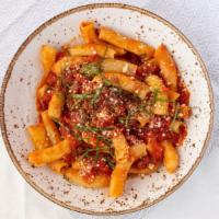 Tufoli Al Pomodoro · tubular pasta, san marzano tomato sugo, grana padano, basil  (gluten free gnocchi available)