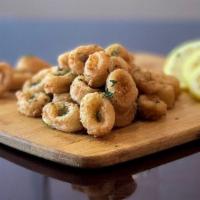 Fried Calamari · Coated in seasoned flour and deep fried to golden brown perfection, comes with marinara sauce.