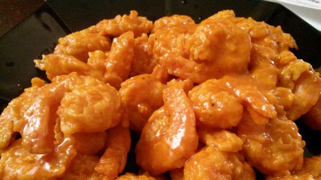 Buffalo Shrimp (5) · Five pieces. Jumbo shrimp coated in seasoned flour, then deep fried to golden brown perfection tossed in a buffalo sauce.
