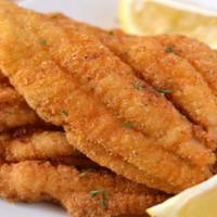 Catfish · Crispy fried catfish fillet, served with two side dishes and bread on the side. We fry in pr...