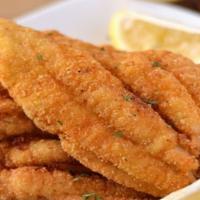 Fried Cajun Catfish · Crispy fried Cajun catfish fillet, served with two side dishes and bread on the side. We fry...