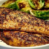 Blackened Grilled Tilapia · Blackened grilled tilapia fillet, served with two side dishes and bread on the side.