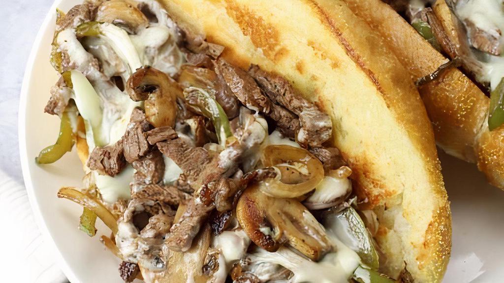 Philly Cheese Steak Sub · Rib eye steak and melted provolone cheese on a toasted sub roll.