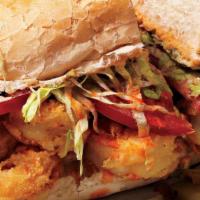 Seafood Po Boy · Made with fried oysters, scallops, and jumbo shrimp on a toasted sub roll.