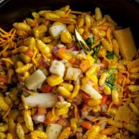 Corn Bhel · Young Kernel corn, rice crispy, tomatoes, peppers, potatoes, onions with homemade dressing. ...