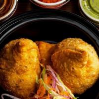 Vegetable Samosa · Turnovers stuffed with green peas, potatoes and spices. ( VEG )