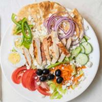 Greek Salad · Tossed garden salad with feta cheese olives over pita bread with grilled chicken.