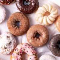 Dozen Donuts · Our donuts come in a variety of delicious flavors. Enjoy with your favorite coffee or grab a...