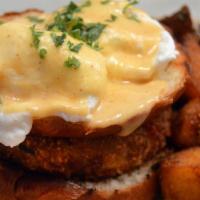 Crab Benedict · jumbo lump crabcake, brioche bun, two poached eggs, and hollandaise. served with home fries.