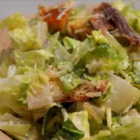 Caesar Salad · Heart of fresh Romaine, claudio's parmigiano reggiano shavings, Spanish anchovies & garlic c...