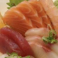 Chirashi Sushi · Assorted sashimi over seasoned rice. served with your choice of soup or salad.