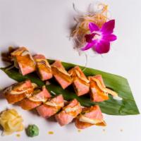 Fantasy Roll · Eel with asparagus inside, seared tuna with green tobiko on top.