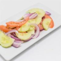 Desi Salad · Fresh onion, cucumber, tomatoes and lemon