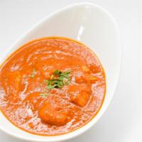 Chicken Vindaloo · Boneless chicken cooked with potatoes and tangy sauce.