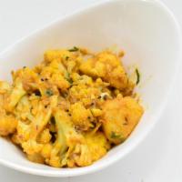Gobhi Achari · Cauliflower cooked with ginger, garlic, potatoes and Indian spices.