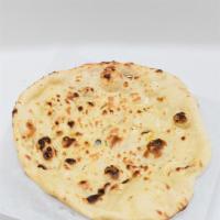 Naan · Unleavened bread baked in tandoor.