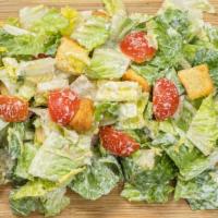 Caesar Salad (Large) · Crisp romaine lettuce, homemade croutons, and Parmesan cheese. Served with a fresh-baked bre...