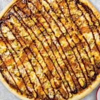 Bbq Butcher Pizza  · BBQ sauce, grilled chicken, and fresh cheese baked on a hand-tossed dough.  Served with a si...