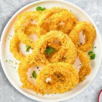 Crispy Rings · (Vegetarian) Sliced onions dipped in a light batter and fried until crispy and golden brown.