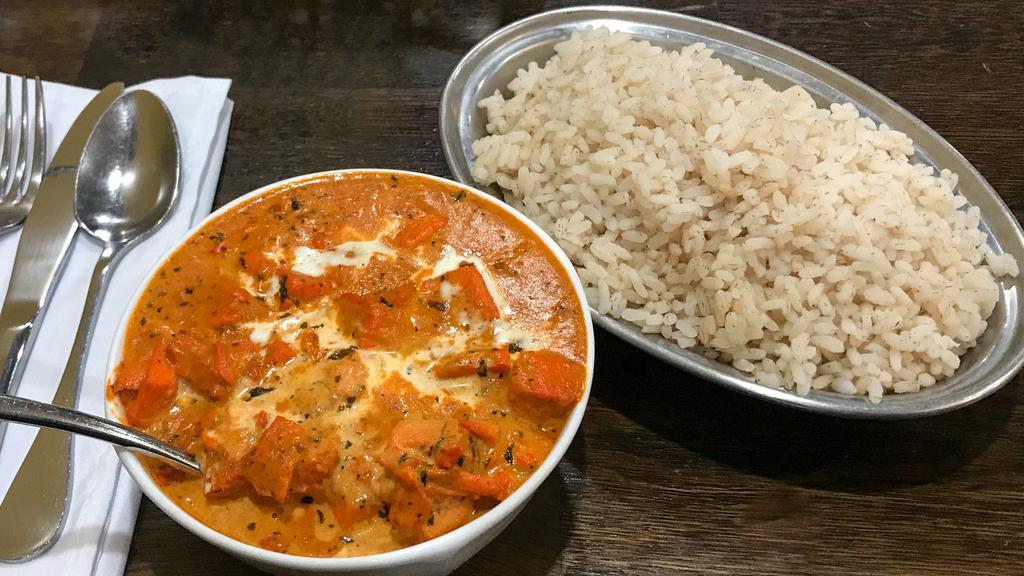 Chicken Tikka Masala · Tandoori style, boneless diced chicken breast cooked in A rich tomato creamy sauce finished with methi leaves.