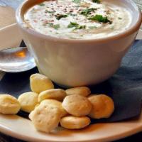 New England Clam Chowder · Rich, creamy and full of clams served with oyster crackers.