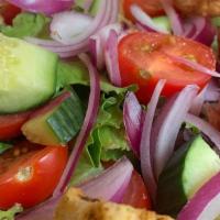 Garden Salad · Spring mix, tomatoes, red onions, cucumbers and garlic-dill croutons. Vegetarian.