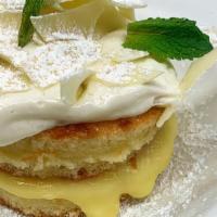 Lemon Cake · Lemon curd, sweet cream cheese, white chocolate shavings..