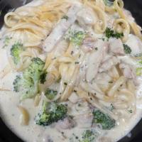 Chicken Broccoli Alfredo · Charred Chicken Strips, Sauteed Broccoli in our Homemade Alfredo Sauce over Fettuccine Pasta