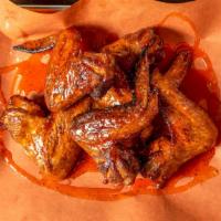 Crispy Smoked Wings · Maple and cherrywood smoked whole wings, tossed in your choice of Kansas City bbq, Honey Hot...