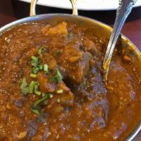 Vindaloo · Spicy. Made with potatoes in a spicy tomato and onion sauce.