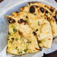 Garlic Naan · Leavened homemade bread topped with garlic.