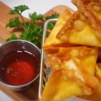 Crab Rangoon · Six pieces. Crabmeat mixed with cream cheese in crispy wonton wrap. Served with sweet and so...