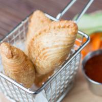 Veggie Curry Puffs · Three pieces. Potato, onion, pea, carrots mixed in curry powder the knot wrapped. Deep fried...