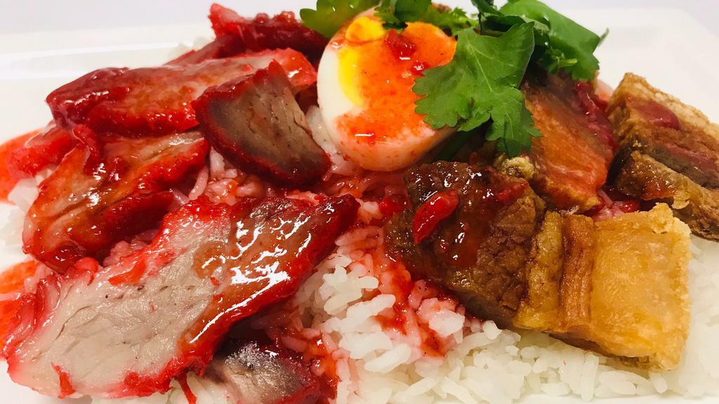 Khao Moo Dang · Bbq pork, crispy pork belly, boiled egg on rice top with sweet sauce.