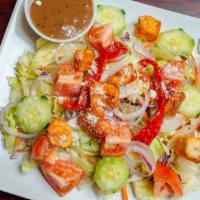 Tossed Salad · Fresh crisp and super-sized salad. served with lettuce tomatoes cucumber onions red peppers ...