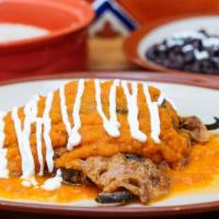 Chile Relleno · Roasted and battered poblano pepper stuffed with Oaxaca cheese, queso fresco, and covered wi...