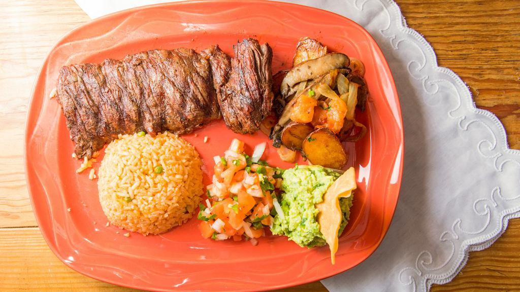 Arrachera · Grilled skirt steak served with guacamole, pico de gallo, sauteed portabella, and red potato.